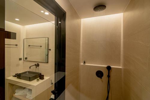 a bathroom with a sink and a mirror at Anantia Villa 1 - Scenic View, Luxury Experience in Episkopi (Heraklion)