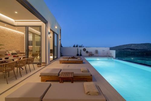 a swimming pool in a house with a view at Anantia Villa 1 - Scenic View, Luxury Experience in Episkopi (Heraklion)