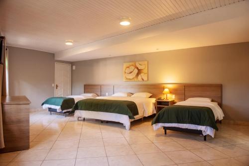 Ένα ή περισσότερα κρεβάτια σε δωμάτιο στο Hotel Vila Verde
