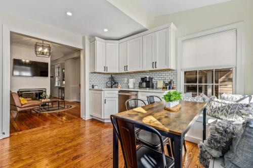 a kitchen and living room with a table and chairs at Fisher House - Downtown Annapolis! in Annapolis