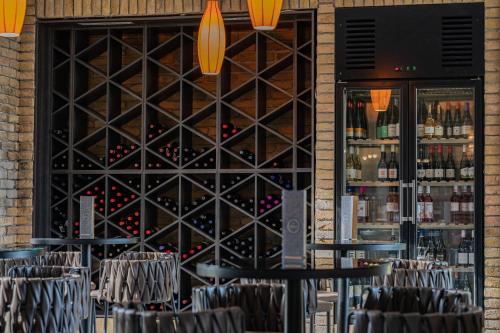a wall of wine bottles in a wine cellar at Hotel Azur Premium in Siófok