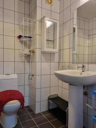 a bathroom with a toilet and a sink at Avatara B condominium B54 in Ban Tha Fat