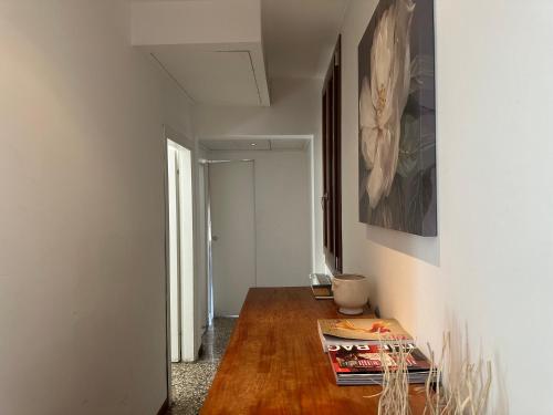 a room with a table with books on it at Ca' d'Oro suite in Venice