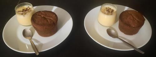 two white plates with food on them with spoons at Les Vagabonds du Mont in Chichilianne