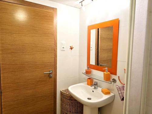 a bathroom with a sink and a mirror at Espliego Pool View Apartment in Torre-Pacheco