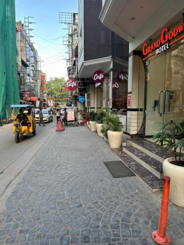 a cobblestone street in the middle of a city at Hotel Grand Godwin - Free Airport Pick-Up in New Delhi