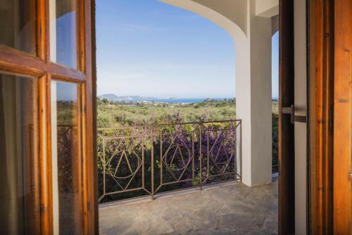 a room with a balcony with a view at MyThea Villa by "elite" in Lithakia