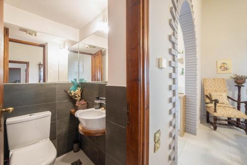 a bathroom with a toilet and a sink at MyThea Villa by "elite" in Lithakia