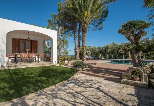 an external view of a villa with a swimming pool at MyThea Villa by "elite" in Lithakia