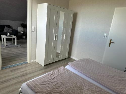 Ένα ή περισσότερα κρεβάτια σε δωμάτιο στο Ferienwohnung Klaus Becker