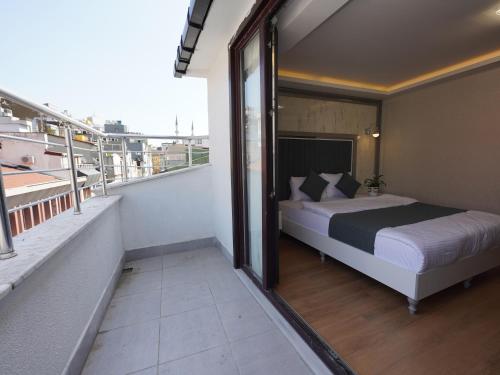 a bedroom with a bed on a balcony at gazelle suites in Istanbul