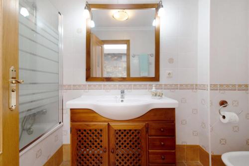 a bathroom with a sink and a mirror at Casa La Herradura in Telde