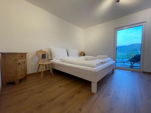 Postel nebo postele na pokoji v ubytování Ferienhaus am Weinberg Krast
