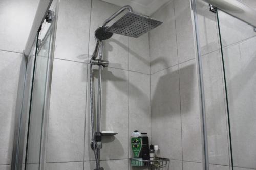 a shower with a shower head in a bathroom at 2+1 Girne CC Towers in Kyrenia