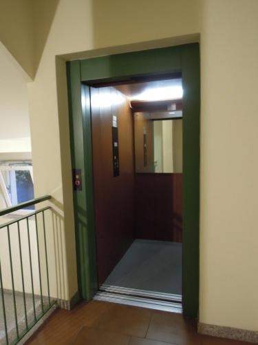 a door in a building with a mirror at A DREAM ON THE LAKE Via Roma in Lierna