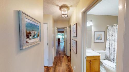 a bathroom with a sink and a toilet and a mirror at Escape to Magnolia Run 2 Bedroom Golf Villa in Pawleys Island