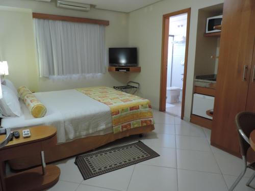 TV a/nebo společenská místnost v ubytování Gloria Garden Suites