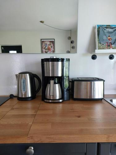 two coffee pots sitting on top of a kitchen counter at SOHL FARM Apartments in Neutrebbin
