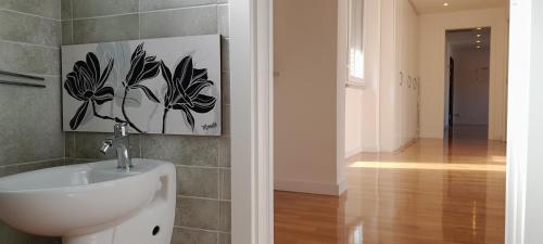 a bathroom with a white sink in a room at Guesthouse Vassallo Due in Rome