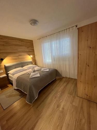 Postel nebo postele na pokoji v ubytování Apartman TeNeN