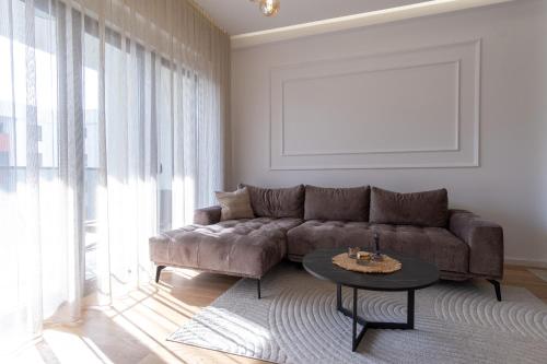 a living room with a couch and a table at City Luxury in Trebinje