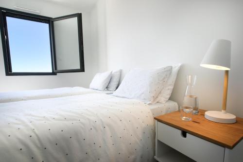 Postel nebo postele na pokoji v ubytování LA VILLA DU BAGNAS