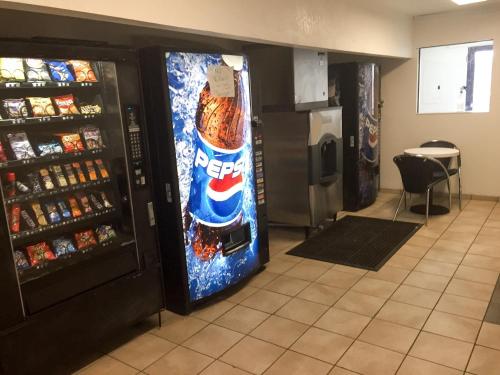 a vending machine with a pepsi cola sign on it at Motel 6-Bessemer, AL - Birmingham in Bessemer