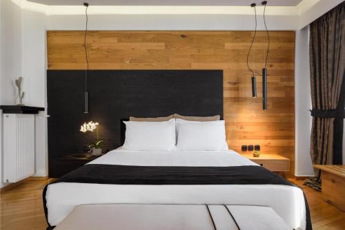 Posteľ alebo postele v izbe v ubytovaní Acropolis Unique Residence