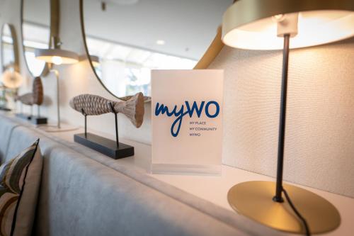 a table with a mw two sign on it at Best Western Plus Le Roof Vannes Bord de Mer in Vannes