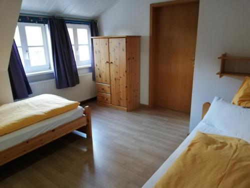 Postel nebo postele na pokoji v ubytování Hotel Steinhagen