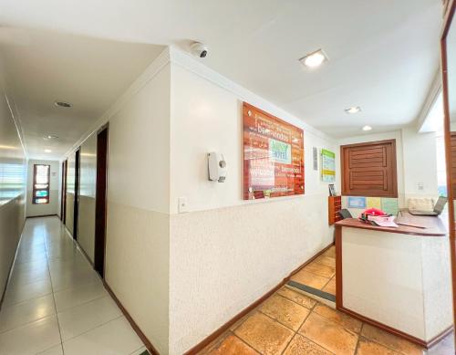 a hallway of a hospital with a reception desk at Mini Hotel in Jericoacoara
