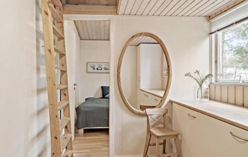 a small bathroom with a mirror and a ladder at 4 Bedroom Pet Friendly Home In Vggerlse in Bøtø By