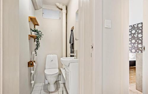 a small bathroom with a toilet and a sink at Amazing Apartment In Kolding With Wifi in Kolding
