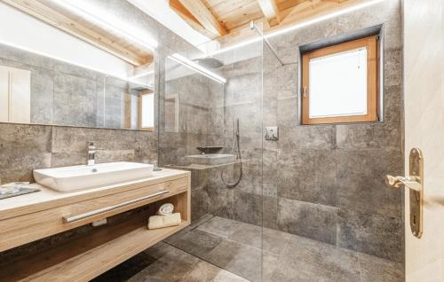 a bathroom with a tub and a sink and a shower at 2 Bedroom Awesome Apartment In St, Anton in Sankt Anton am Arlberg