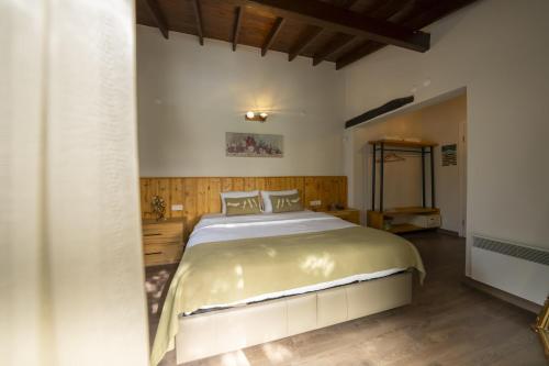 a bedroom with a large bed in a room at Bir Dem Urla in Urla
