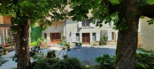 a house with two trees in front of it at Les Vagabonds du Mont in Chichilianne