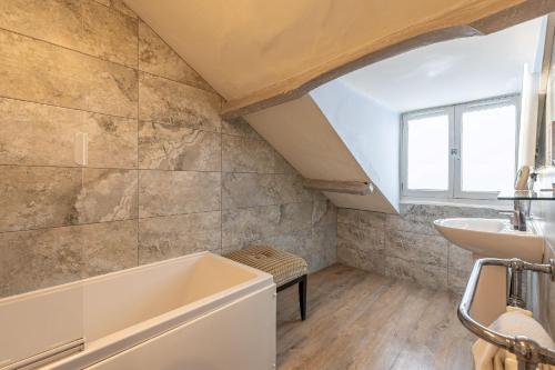 a bathroom with a sink and a bath tub at 30 Frenchgate in Richmond