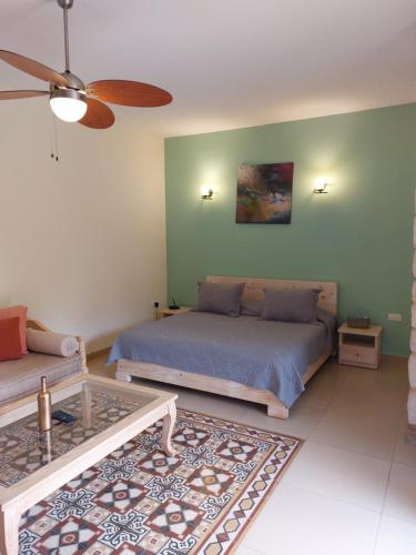 a living room with a bed and a couch at Abdelli Terraces in Batroun in Batroûn