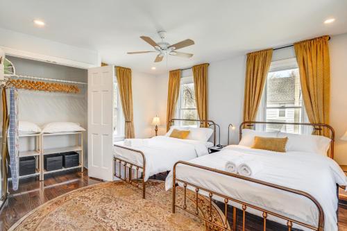 a bedroom with two beds and a ceiling fan at Family-Friendly Mays Landing Home Near The Cove! in Gravelly Run