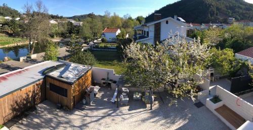 an overhead view of a house with a table and trees at Casa da Avó Olinda in Góis