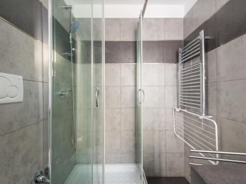 a shower with a glass door in a bathroom at Auditorium Luxury Apartments in Rome