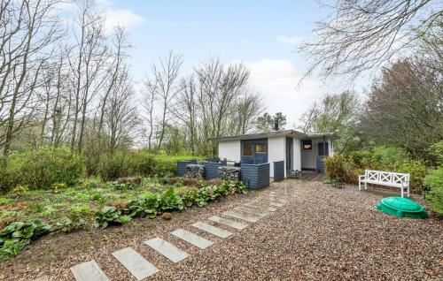 a small shed with a garden in front of it at 2 Bedroom Beautiful Home In Esbjerg V in Esbjerg