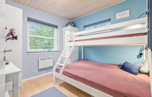 a bedroom with a bunk bed and a desk at 2 Bedroom Beautiful Home In Esbjerg V in Esbjerg