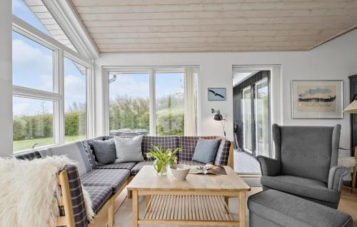 a living room with a couch and chairs and a table at Nice Home In Haderslev With Lake View in Haderslev