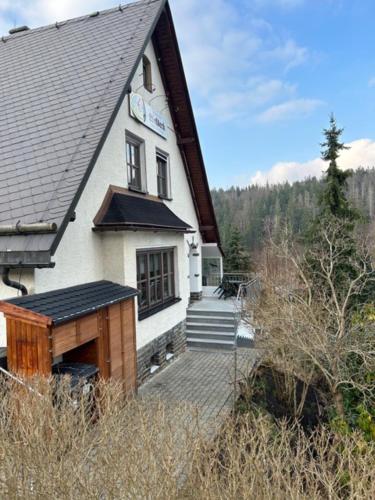 a building with a stairway leading up to it at Ferienhaus Waldeck in Marienberg