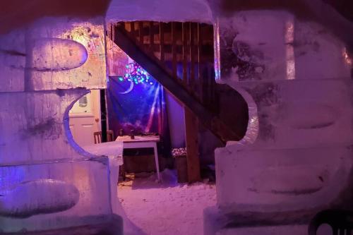 a house made out of ice with a staircase at Loft La Coquille de Lune in Sainte-Rose-du-Nord