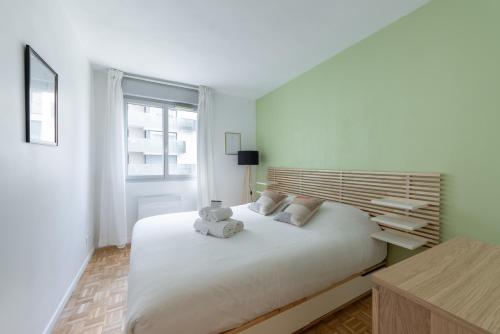 En eller flere senge i et værelse på Le cinquième ciel - 75m2 avec garage privé