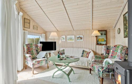 a living room with a couch and chairs and a table at Awesome Home In Svendborg With Kitchen in Svendborg