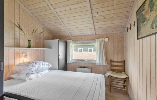 a bedroom with a white bed and a window at Awesome Home In Svendborg With Kitchen in Svendborg