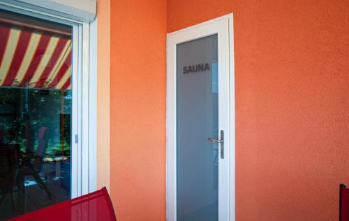 a door with a sign on the side of a building at Cozy Apartment In Koper With Sauna in Koper